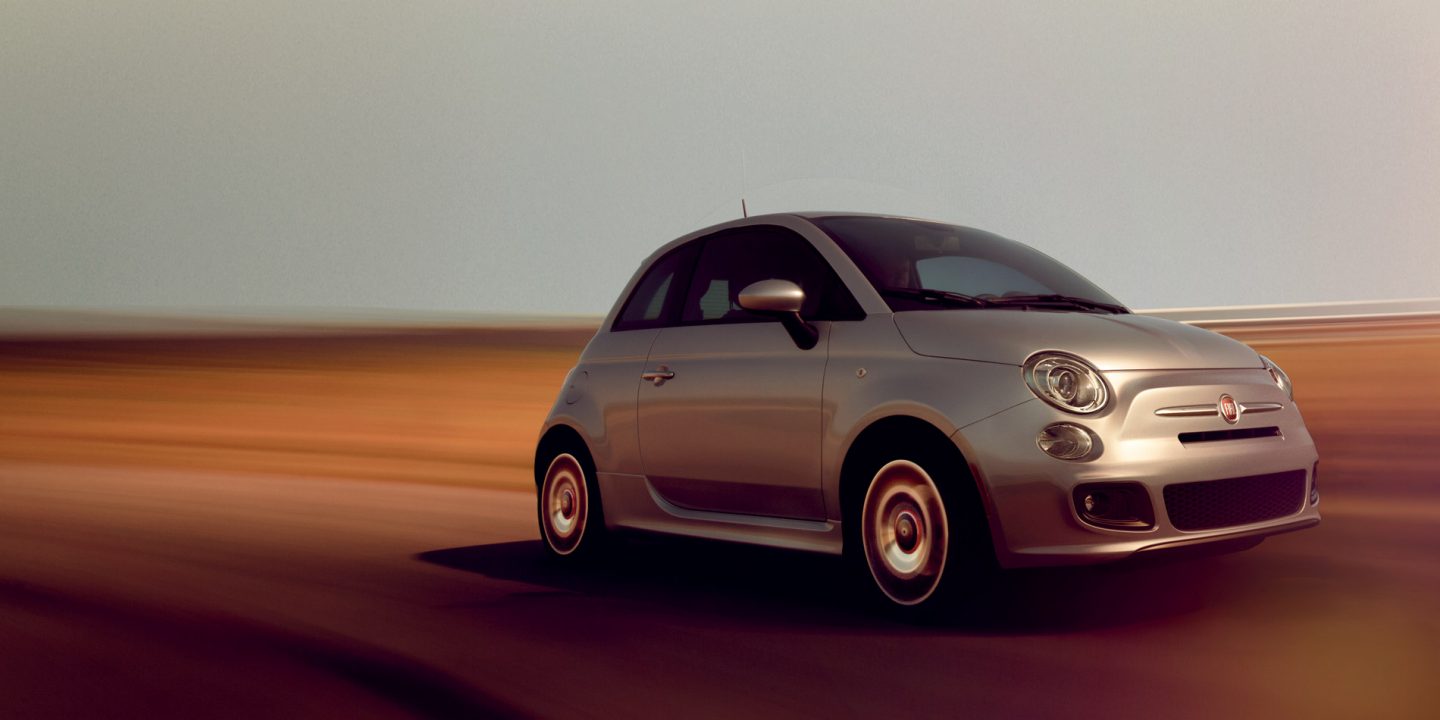 Overhead view of a 2019 Fiat 500 Pop parked on the roof of a parking structure.